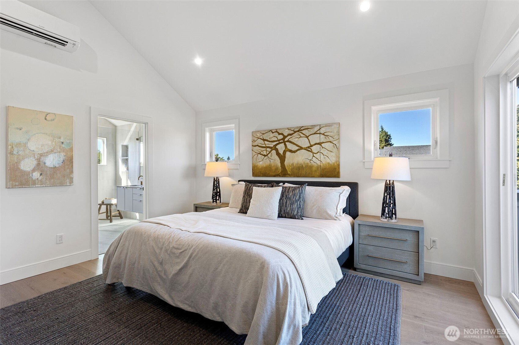 8007 25th Avenue Northwest Seattle, WA 98117 - Photo 25 of 31 a bedroom with a bed and a painting on the wall