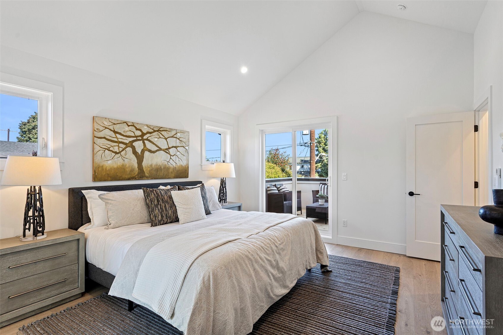 8007 25th Avenue Northwest Seattle, WA 98117 - Photo 26 of 31 a bed room with a bed and a painting on the wall