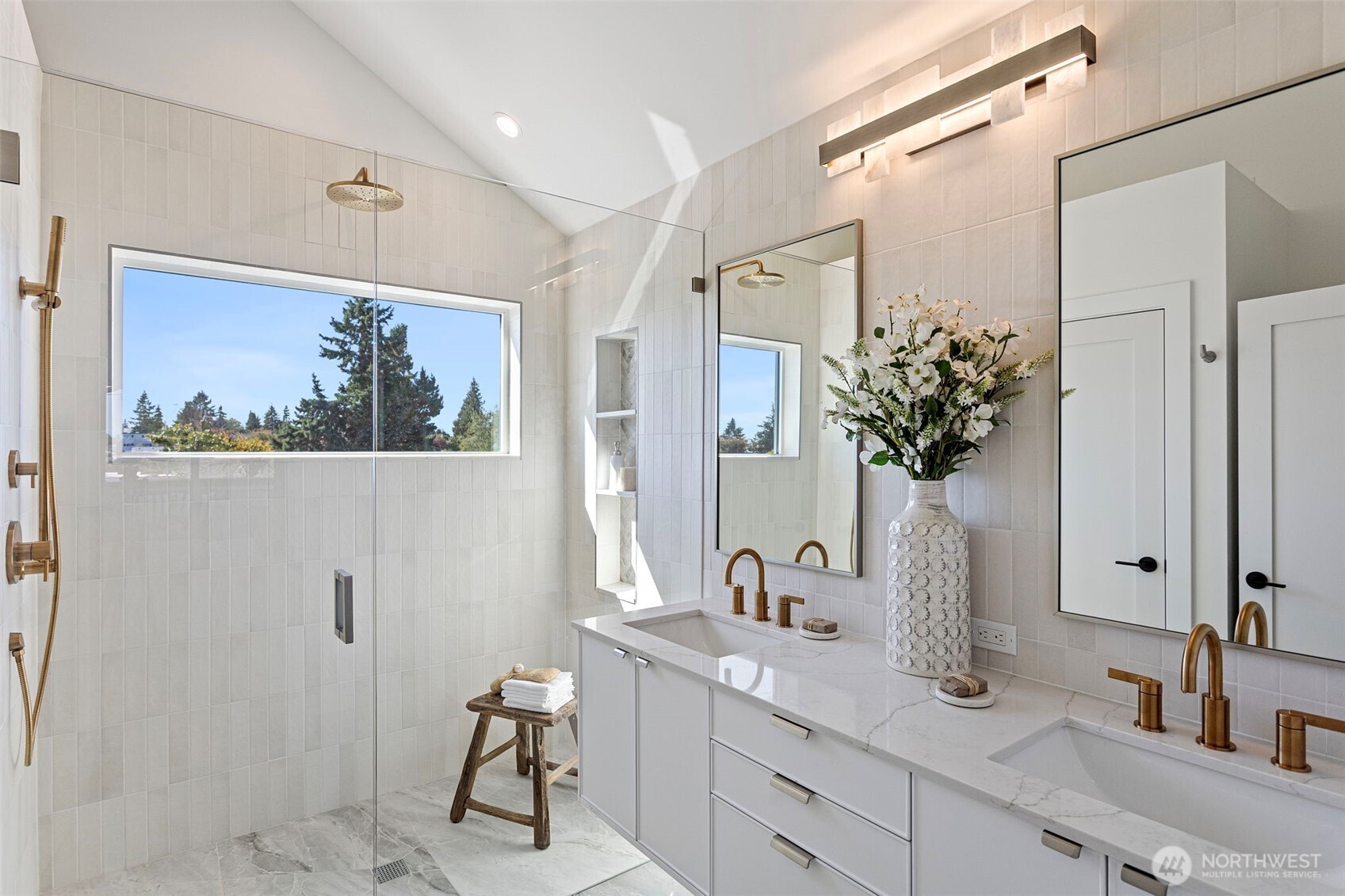 8007 25th Avenue Northwest Seattle, WA 98117 - Photo 29 of 31 a bathroom with a double vanity sink and a mirror