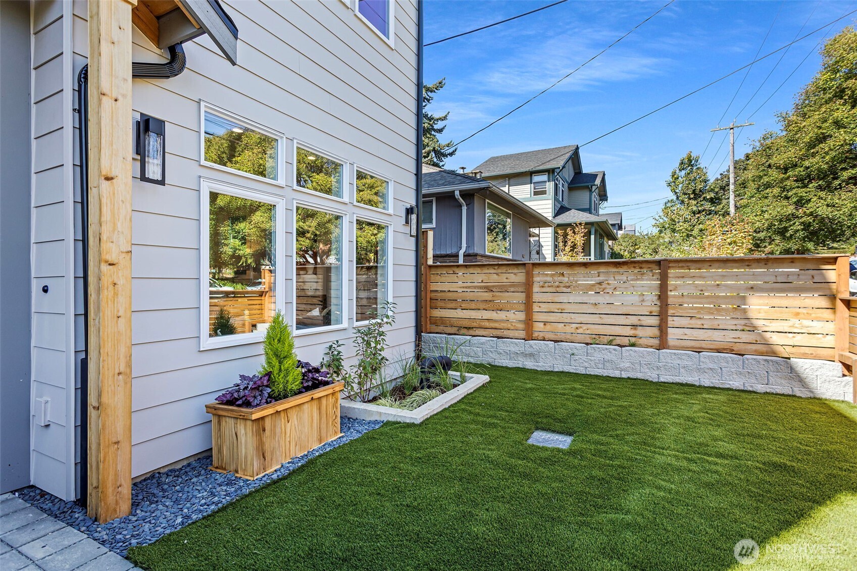 8007 25th Avenue Northwest Seattle, WA 98117 - Photo 4 of 31 a front view of a house with a yard