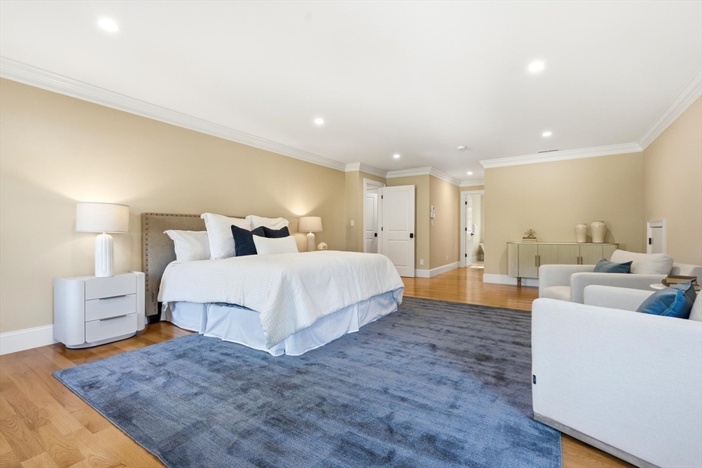 6 Flintlock Road Lexington, MA 02420 - Photo 21 of 39 a bedroom with a large bed and a couch