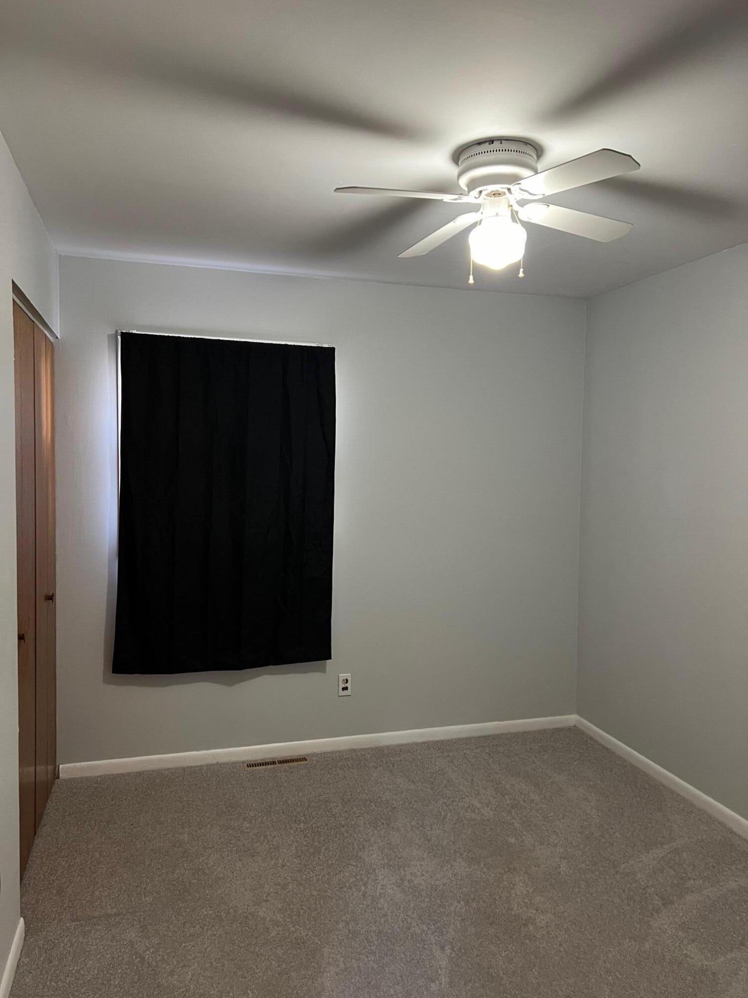 655 Gene Lane Valparaiso, IN 46385 - Photo 14 of 21 a view of an empty room with a fan