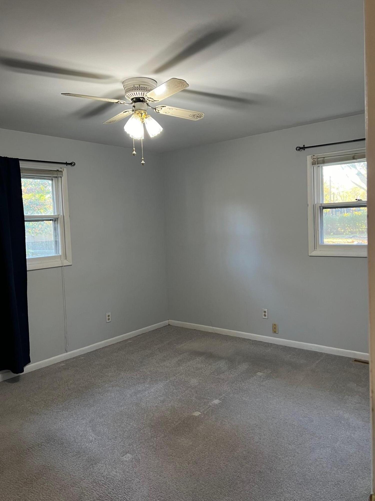 655 Gene Lane Valparaiso, IN 46385 - Photo 16 of 21 an empty room with a window and a fan