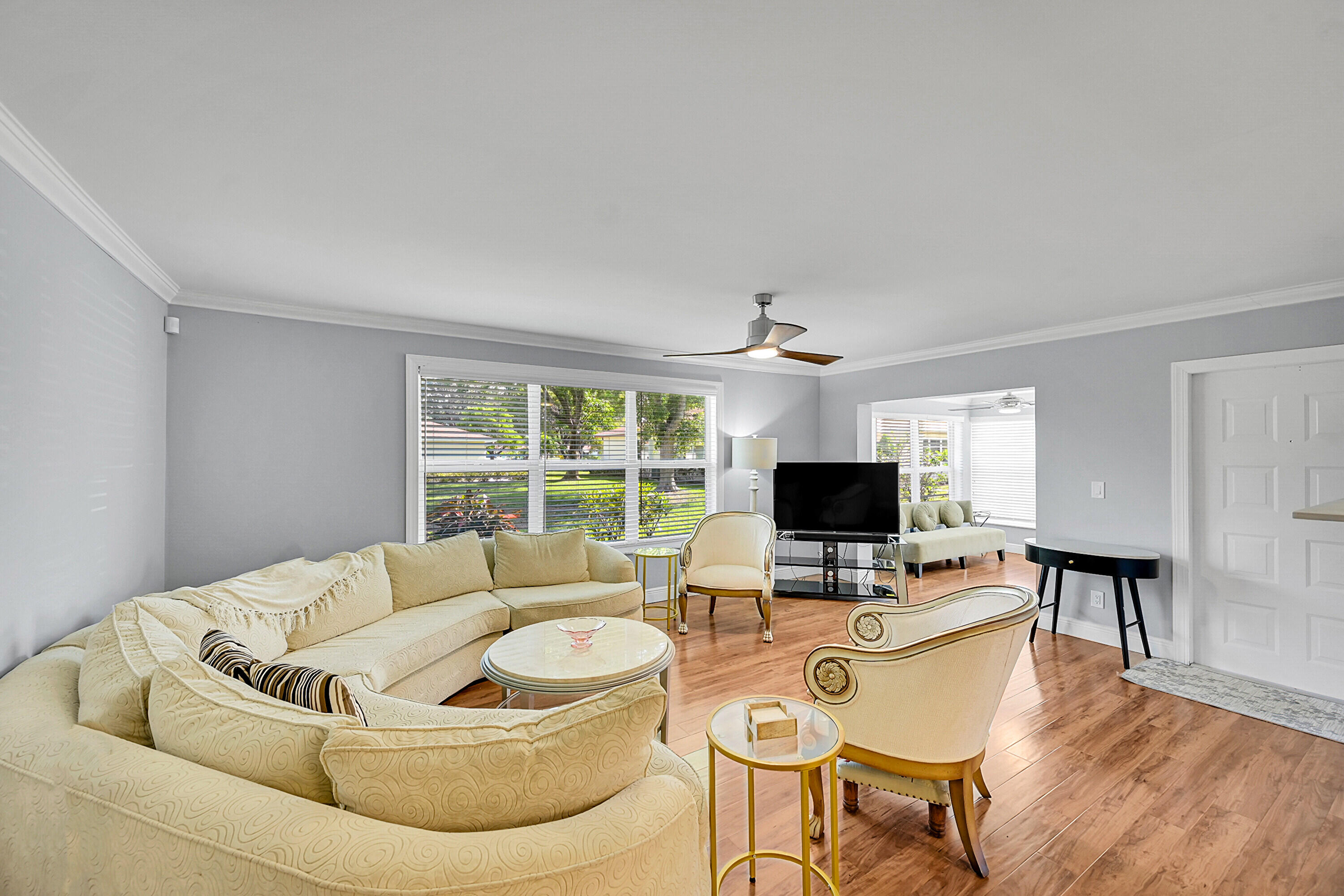 4585 Northwest 3rd Street, Unit D Delray Beach, FL 33445 - Photo 6 of 45 Living Room + SunRoom