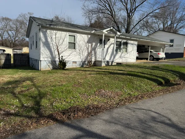 a view of a house with a back yard