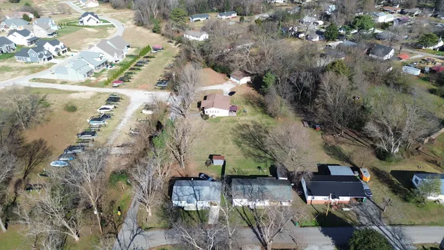 an aerial view of lot of residential houses with outdoor space