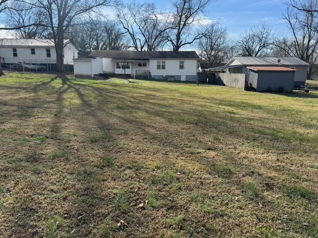 a swimming pool with wooden fence