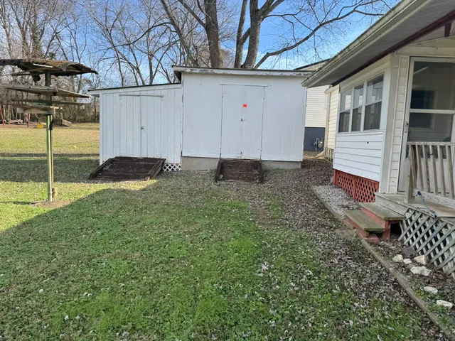 a kitchen with a sink cabinets and window