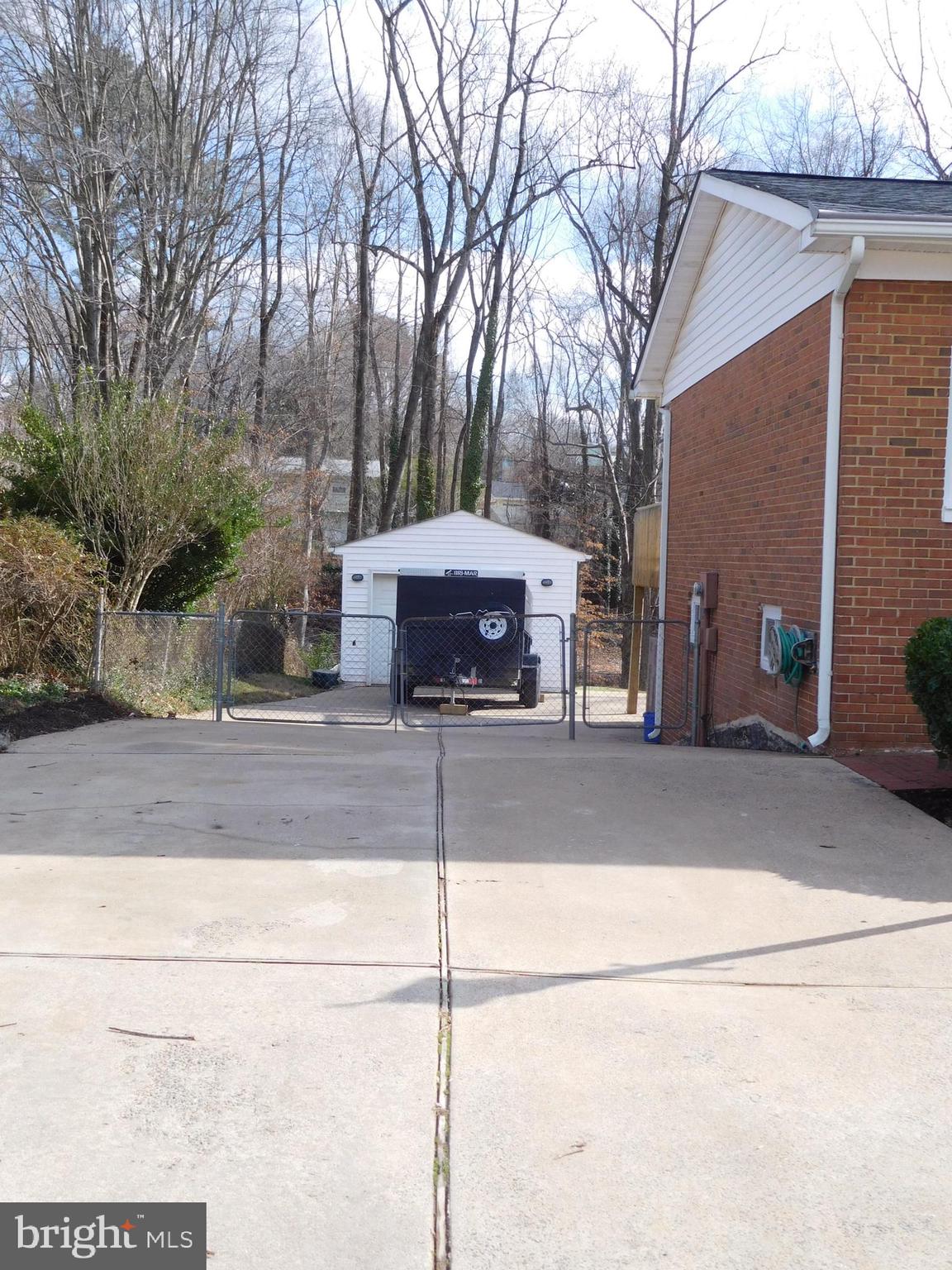 13609 Kingsman Road Woodbridge, VA 22193 - Photo 3 of 45 OVERSIZED CONCRETE DRIVEWAY, VIEW TOWARD GARAGE