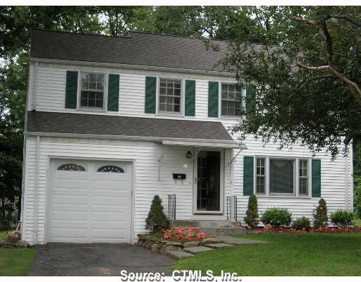 31 Carleton Road West Hartford, CT 06107 - Photo 1 of 1 a front view of a house with a yard and outdoor seating