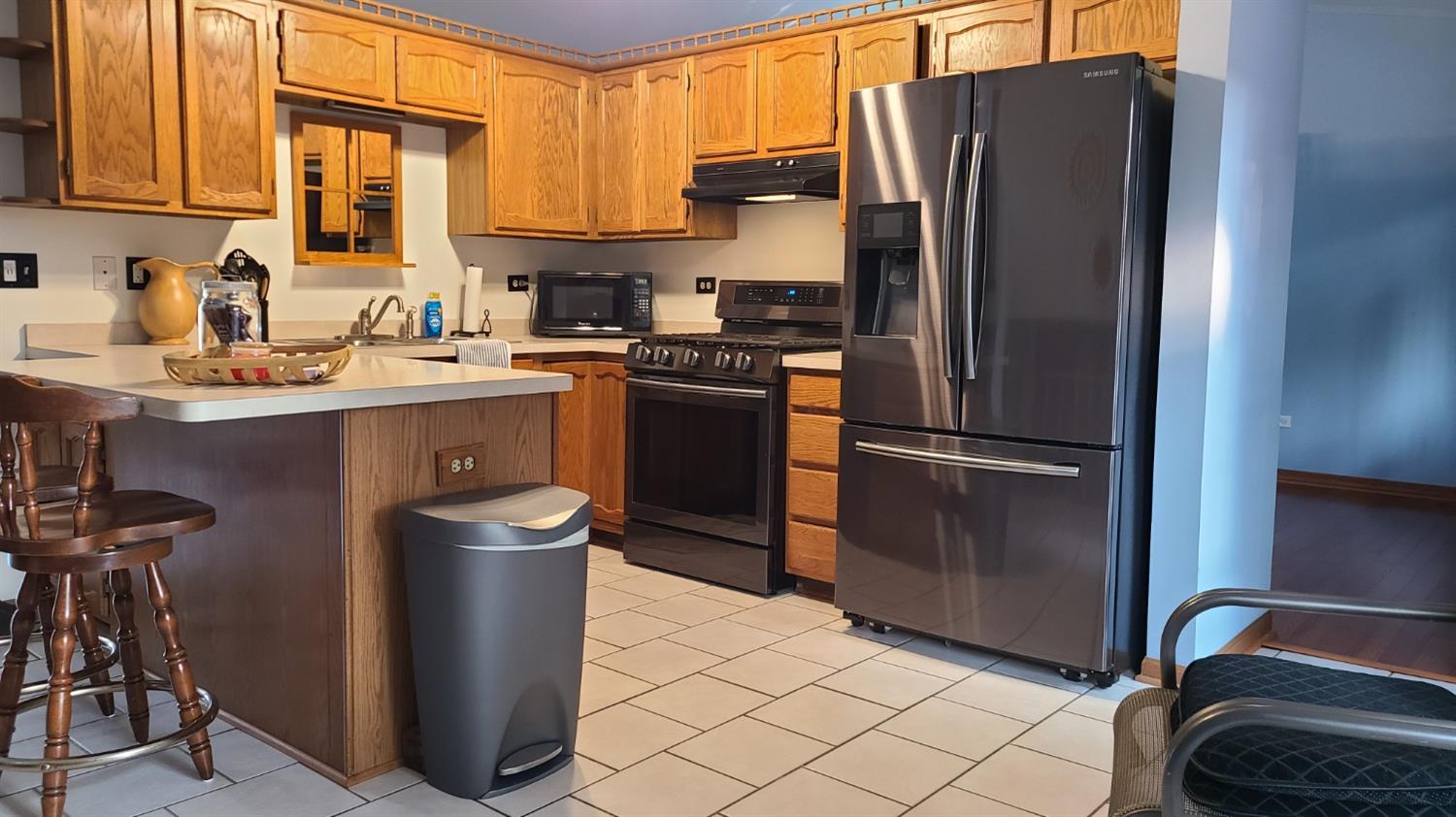 2330 Boulder Road Dyer, IN 46311 - Photo 8 of 24 a kitchen with a refrigerator and a sink