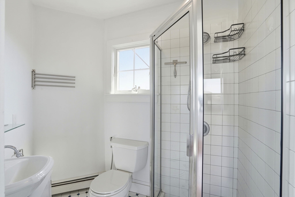 7 Mildred Street Hull, MA 02045 - Photo 12 of 42 a bathroom with a toilet and shower