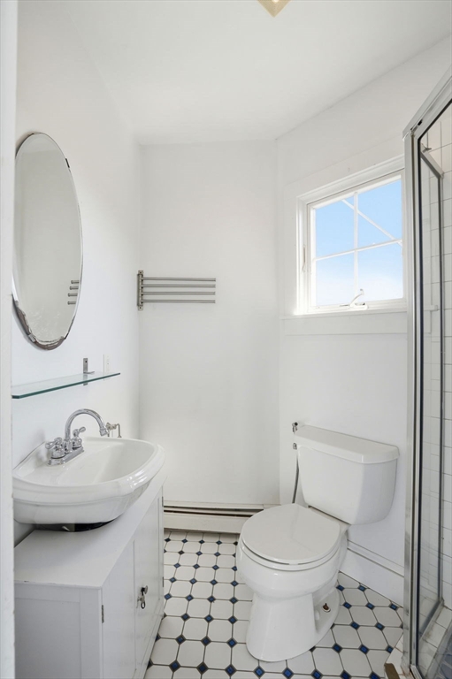 7 Mildred Street Hull, MA 02045 - Photo 13 of 42 a bathroom with a sink a toilet and a mirror