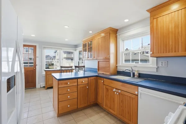 a kitchen with stainless steel appliances granite countertop a sink and cabinets