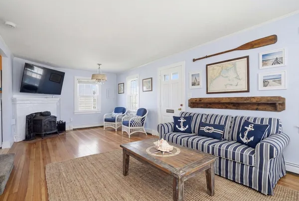a bedroom with furniture and a flat screen tv