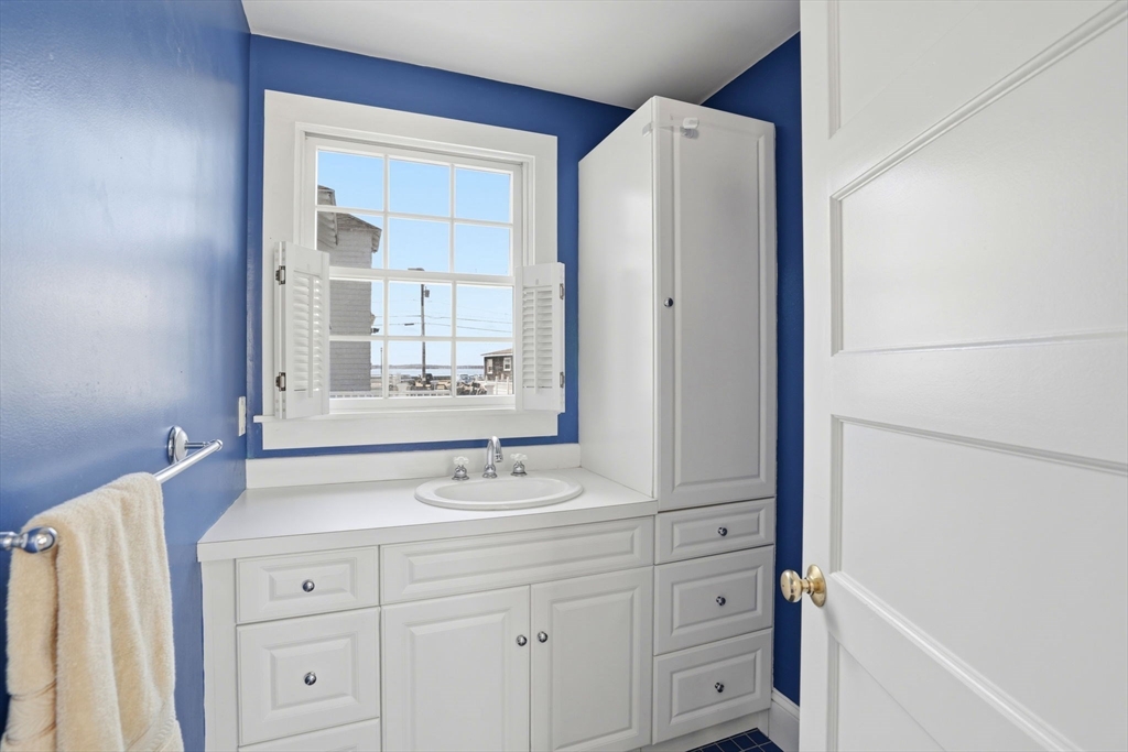 7 Mildred Street Hull, MA 02045 - Photo 26 of 42 a bathroom with a sink vanity and a mirror