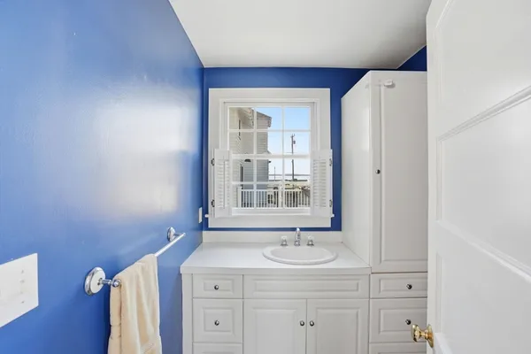 a bathroom with a sink a vanity and a mirror