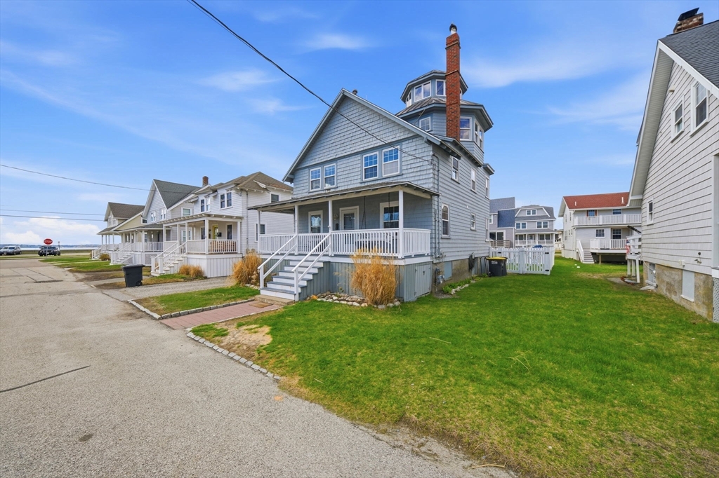 7 Mildred Street Hull, MA 02045 - Photo 29 of 42 a front view of a house with a yard table and chairs