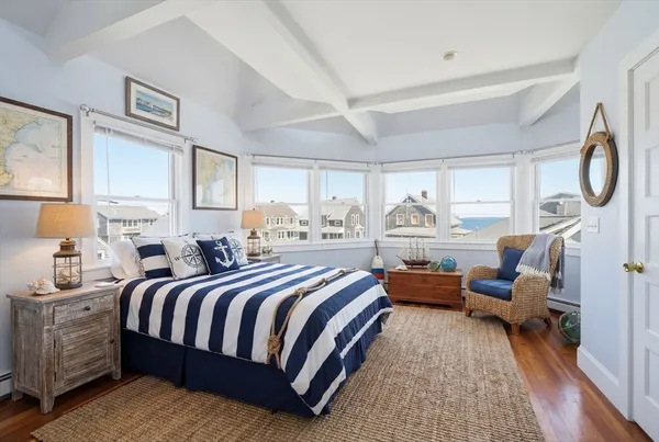 a bedroom with bed and window