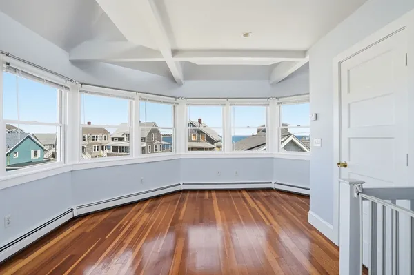 a view of a hardwood floor in a room