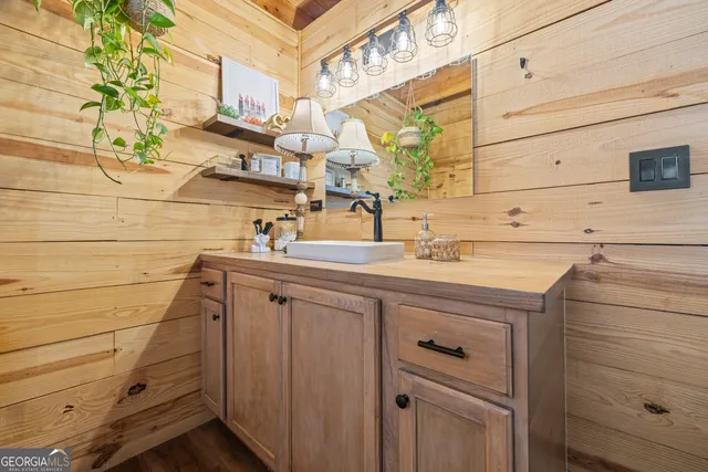 a view of a swimming pool with a yard and furniture