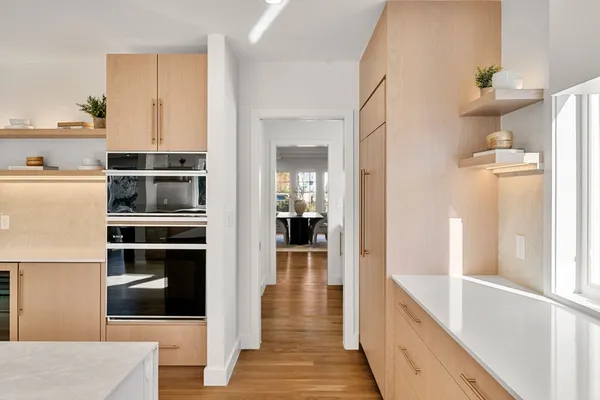 a view of a kitchen from the hallway
