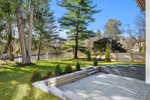 a view of yard with swimming pool and trees