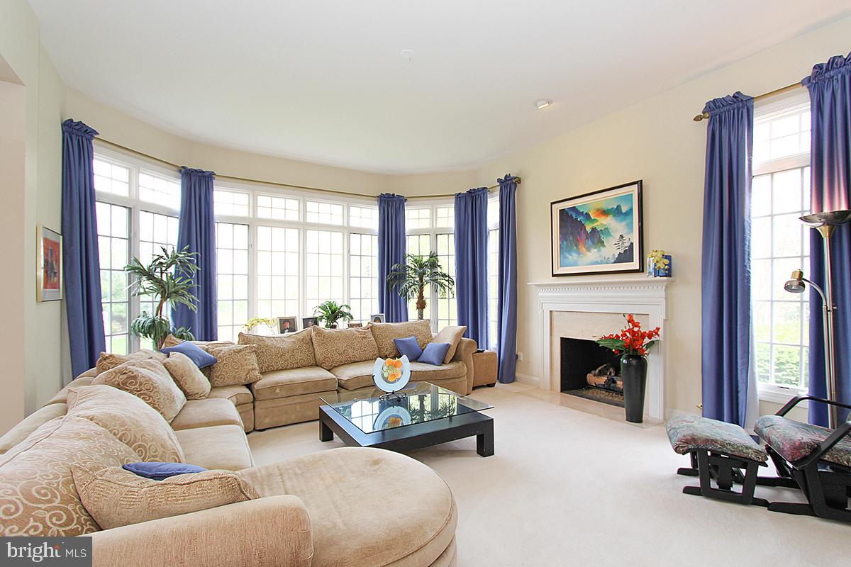 15930 Spyglass Hill Loop Gainesville, VA 20155 - Photo 13 of 46 Family Room w/Wall of Windows & Gas Fireplace