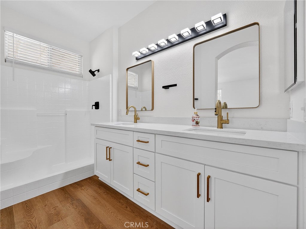 1436 Riviera Avenue Banning, CA 92220 - Photo 27 of 43 a bathroom with a sink vanity and mirror