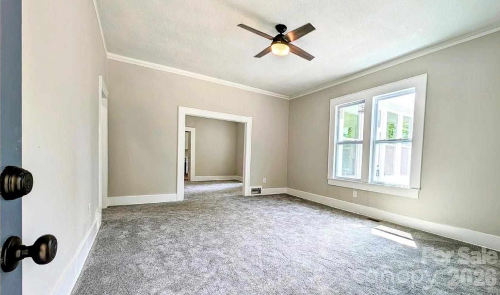 113 Brawley Street Chester, SC 29706 - Photo 2 of 12 a view of an empty room with a window