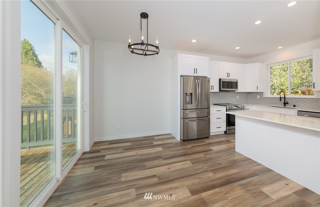 2716 Callow Road, Unit A Lake Stevens, WA 98258 - Photo 11 of 34 a kitchen with a refrigerator and a sink