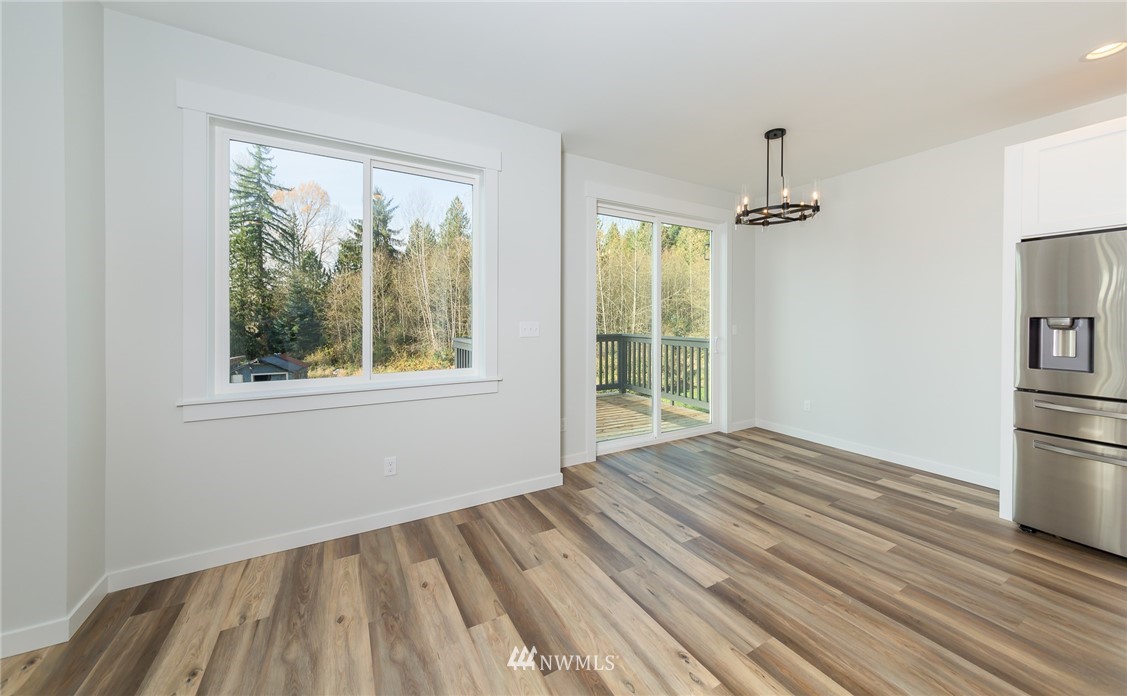 2716 Callow Road, Unit A Lake Stevens, WA 98258 - Photo 12 of 34 a view of empty room with wooden floor and fan