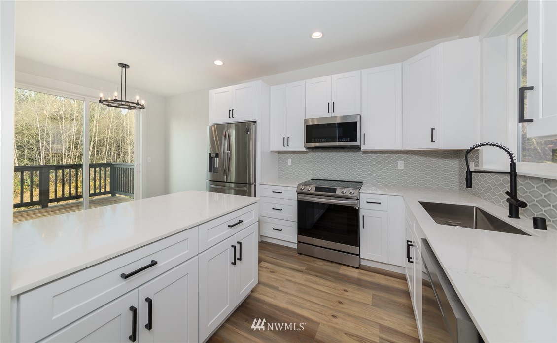 2716 Callow Road, Unit A Lake Stevens, WA 98258 - Photo 15 of 34 a kitchen with a sink stove and refrigerator