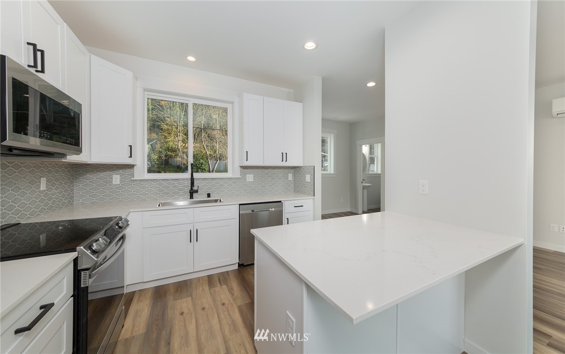 2716 Callow Road, Unit A Lake Stevens, WA 98258 - Photo 16 of 34 a kitchen with a sink stove and microwave