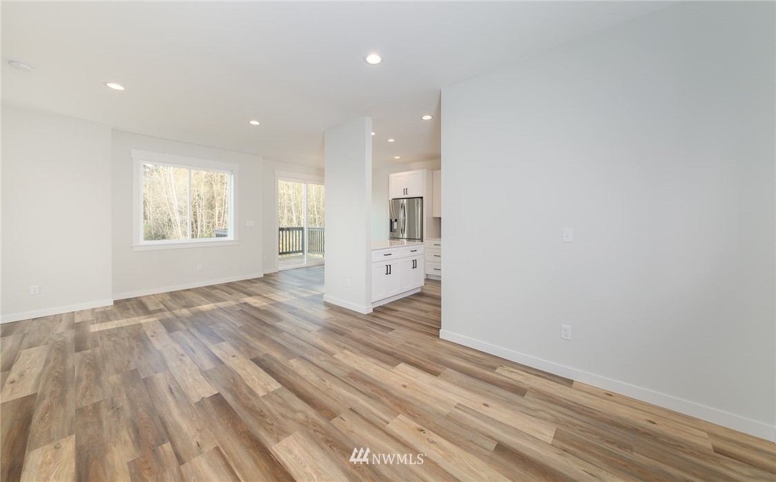 2716 Callow Road, Unit A Lake Stevens, WA 98258 - Photo 19 of 34 an empty room with wooden floor and windows