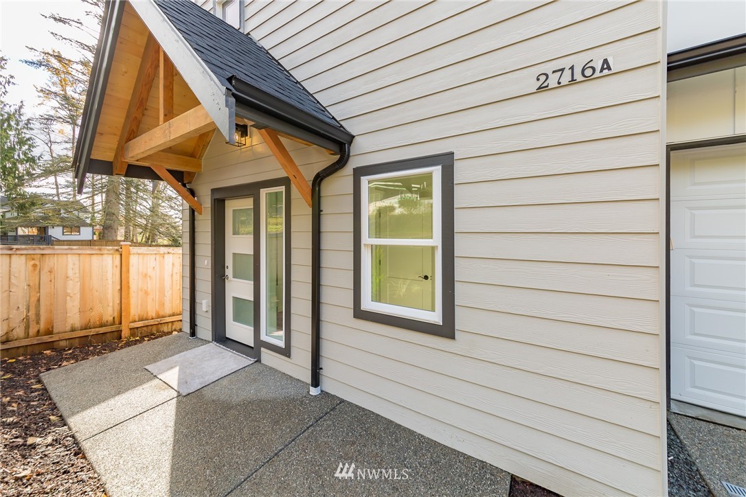 2716 Callow Road, Unit A Lake Stevens, WA 98258 - Photo 3 of 34 a view of a house with a door and wooden walls