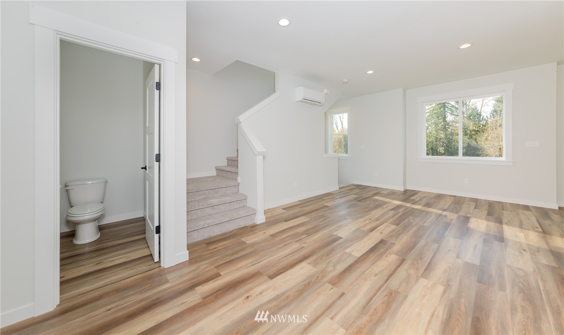 2716 Callow Road, Unit A Lake Stevens, WA 98258 - Photo 21 of 34 a view of a room with wooden floor and a toilet