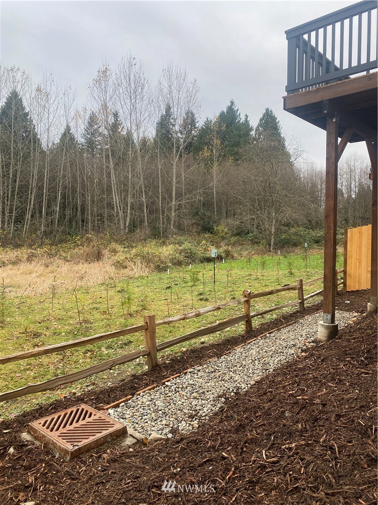 2716 Callow Road, Unit A Lake Stevens, WA 98258 - Photo 32 of 34 a view of a yard with wooden fence