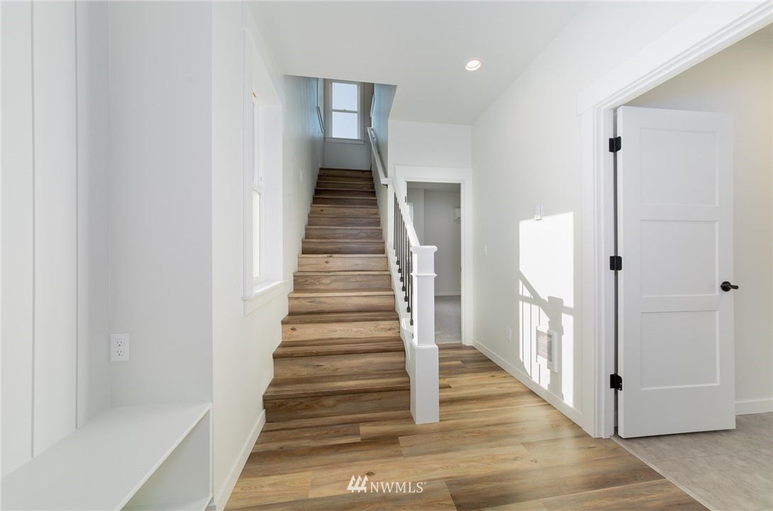 2716 Callow Road, Unit A Lake Stevens, WA 98258 - Photo 9 of 34 a view of a hallway with wooden floor and entryway