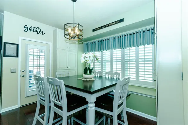 a kitchen with a sink and wooden cabinets