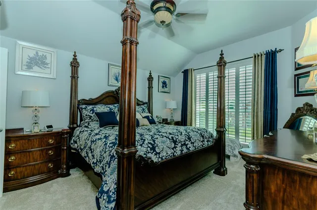 a bathroom with a granite countertop sink mirror vanity and toilet