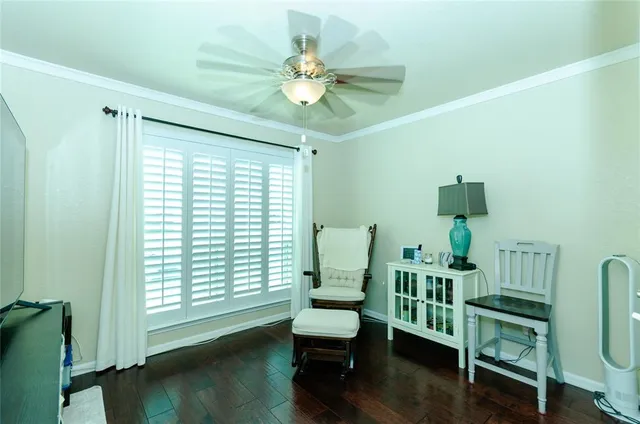 a bedroom with a bed a dresser and a window