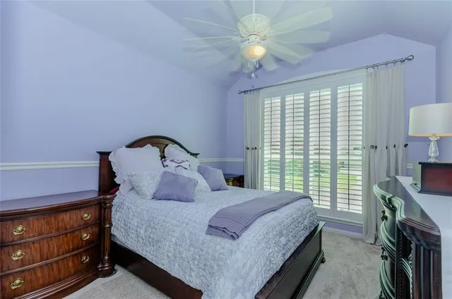 a living room with furniture and a dining table