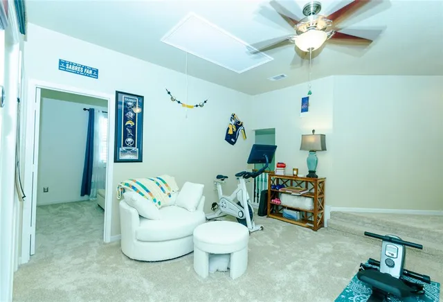 a bathroom with a sink mirror and toilet