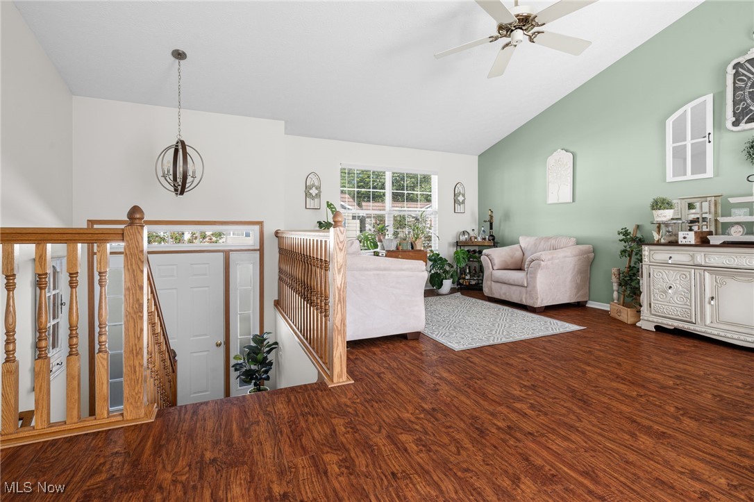 64 River Ridge Lane Munroe Falls, OH 44262 - Photo 5 of 25 Entryway featuring dark wood-type flooring, high vaulted ceiling, a ceiling fan, and a chandelier