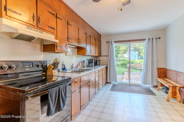 a view of a kitchen with furniture and a kitchen