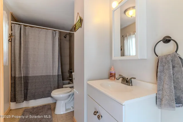 a room with furniture and air hockey table