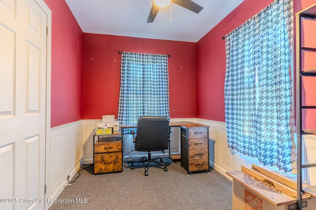 a room with a wooden floor and a window