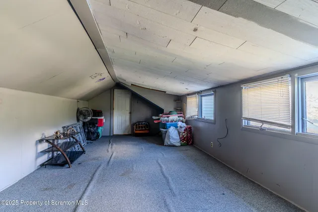 a view of a house with a yard porch and sitting area