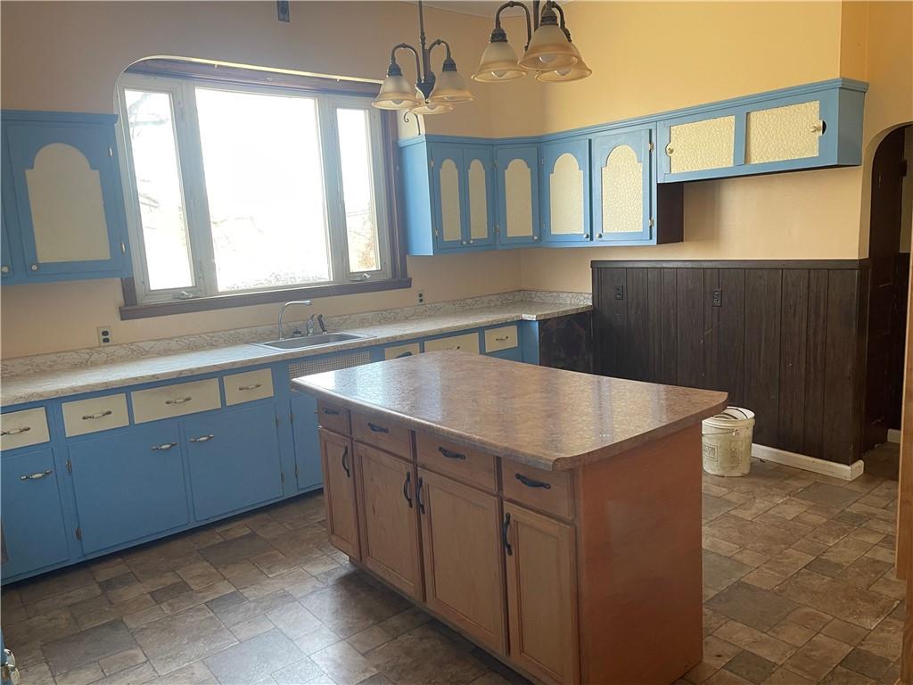 943 Newell Road Fayette City, PA 15438 - Photo 11 of 27 a kitchen with a stove a sink and a window